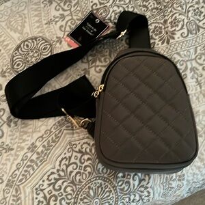 New with tags 9x6x3 greyish/green sling bag with gold hardware.
